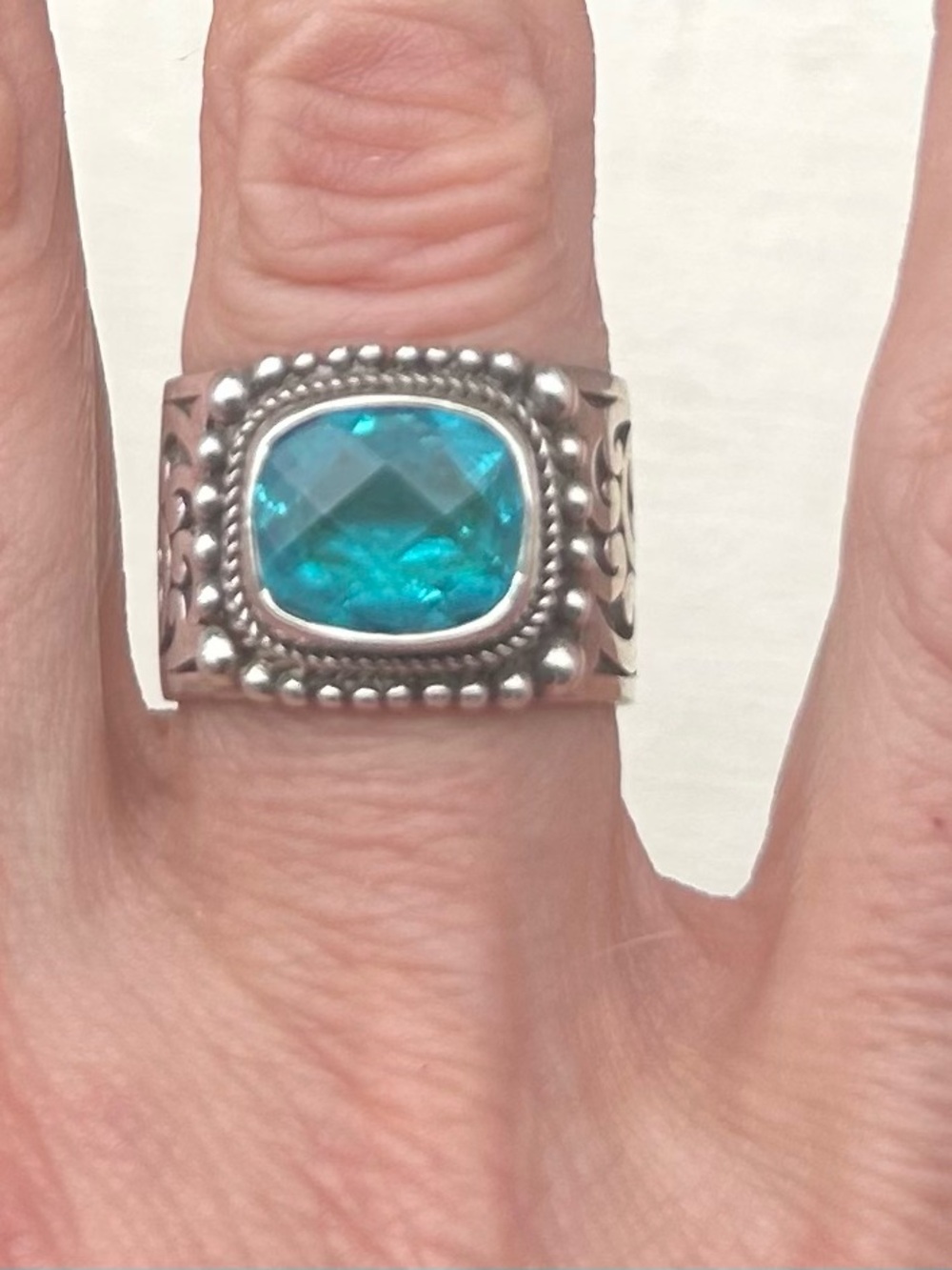 Sterling Silver Ring with Caribbean Blue Topaz Cushion Stone